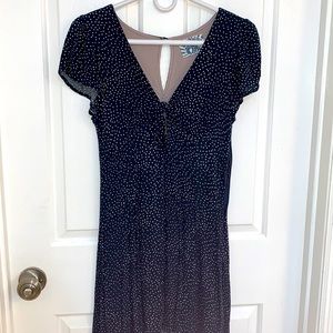 Unique summer dress with white pok-a-dots and a peek a boo slit at cleavage.